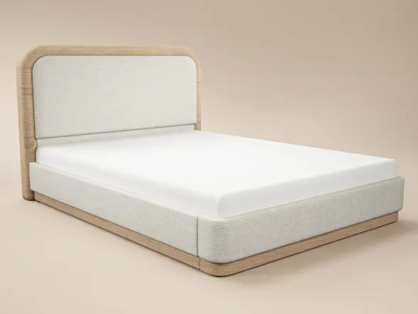 Cream upholstered bed with padded headboard and wood base detail. A modern low profile bed frame designed for comfort and style.
